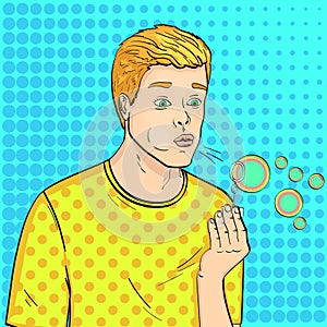 Pop art background. Young guy and soap bubbles. A game for children. Vector, comic style.