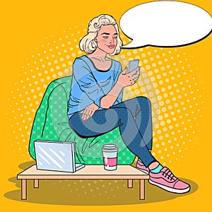 Pop Art Blonde Woman Working with Laptop and Smartphone in a Coffee Shop