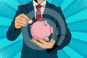 Pop art Businessman hand putting coin in a piggy bank money savings.