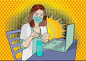 Female doctor disinfecting her hands before working on laptop