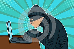 Pop art hacker thief hacking into a computer photo