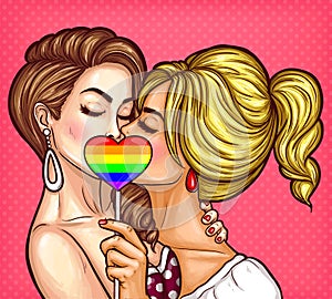 pop art lesbian couple kissing and covering their lips with sign on stick in the form of a rainbow heart