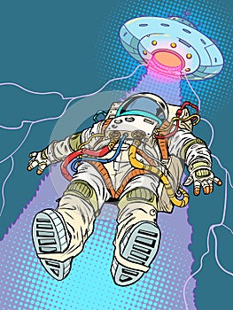 Pop Art Retro The astronaut is lifted towards himself by a flying saucer beam. Paranomal phenomena in the galaxy and