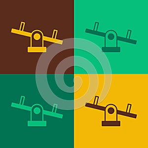 Pop art Seesaw icon isolated on color background. Teeter equal board. Playground symbol. Vector