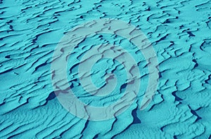 Pop art surreal style turquoise blue colored desert sand ripple patterns