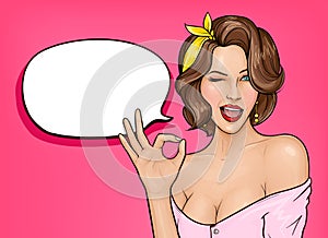 Pop art woman showing ok sign and winking