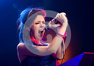 Pop star singing on stage