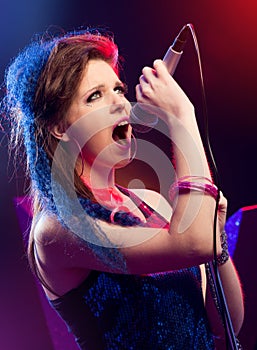 Pop star singing on stage