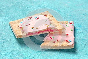 Pop tart, broken, on a blue background photo