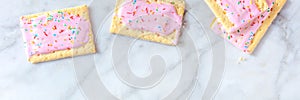 Pop tart, or toaster pastry panorama, top shot on a marble background