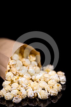 Popcorn box in front of black background, copyspace