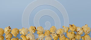 Popcorn flat lay composition on color background. cinema snack concept Modern style. creative photography. copy space