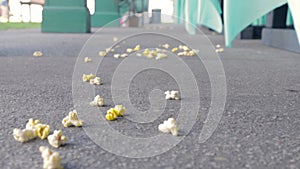 Popcorn on the ground blowing in the wind