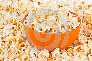 Popcorn in a orange bowl