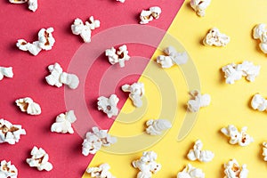 Popcorn pattern on red and yellow background close-up, top view