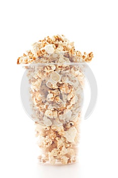 Popcorn In Plastic Cup On White Background.