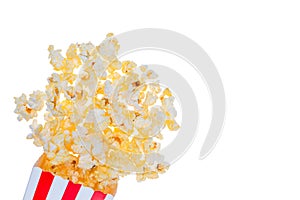 Popcorn in red and white striped cardboard bucket isolated on white background. Movie Popcorn isolated on white with clipping path