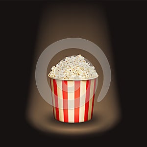 Popcorn round bucket cup in spotlight. Realistic vector cinema heaped pop corn paper bowl red white box. super star movie snack.