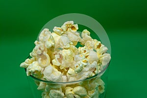 Popcorn is a snack that is a small portion of food generally eaten between meals