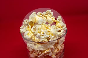 Popcorn is a snack that is a small portion of food generally eaten between meals.
