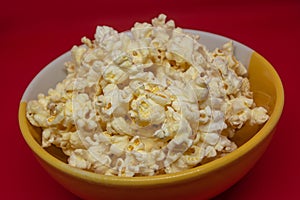 Popcorn is a snack that is a small portion of food generally eaten between meals.