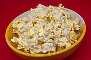 Popcorn is a snack that is a small portion of food generally eaten between meals.