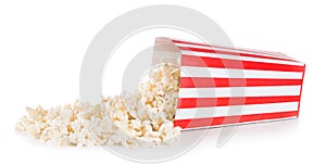 Popcorn spilled from a square box isolated on white background