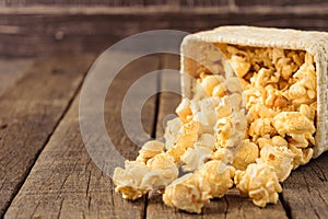 Popcorn in the Wicker baskets on the table wood