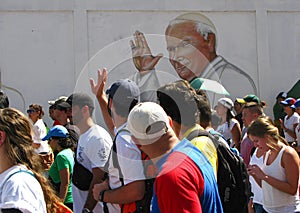 Pope John Paul II graffiti waves at crowd in a protests in the streets of Caracas Venezuela against the government of Nicolas