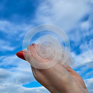 Poplar fluff in his hand against the blue sky. Weightlessness, lightness, the concept of allergy.