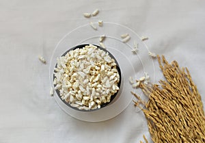 Popped Rice or Nel Pori also known as Puffed Lahi or Karthigai Pori in wooden bowl