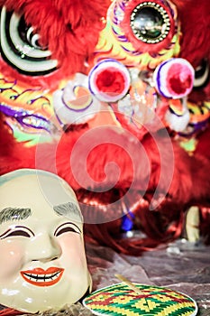 Popper smiling mask and red lion dance costume prepare for Chine