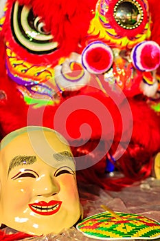 Popper smiling mask and red lion dance costume prepare for Chine