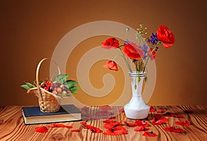 Poppies in a vase, and cherries