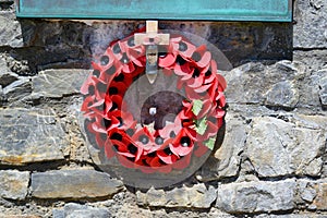 Poppy remembrance wreath on Falklands War Memorial, Stanley, Falkland Islands