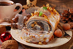 Poppy seed cake and coffee for christmas on wooden table