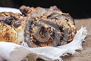 Poppy seed cake. Yeast cake with poppy seeds on linen cloth.