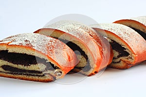 Poppy seed strudel sprinkled with sugar