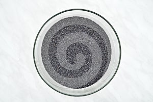 Poppy seeds in the glass bowl