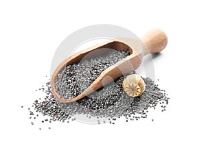 Poppy seeds and wooden scoop on background