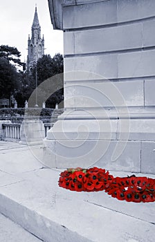 Poppy wreaths on war memorial