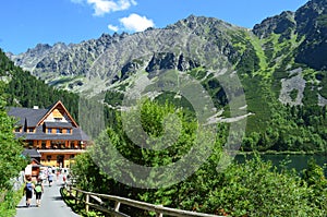 Popradske Pleso mountain lake in High Tatras mountain range in Slovakia - a beautiful sunny summer day in a popular hiking and tra