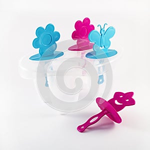 Popsicle molds on white background