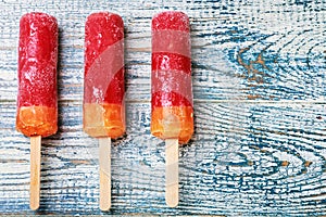 Popsicles on a wooden table