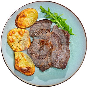 Popular all over the world dish of appetizing fried beef steak, subject with baked potatoes