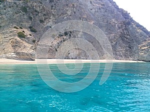 Turquoise water at famous beach of Egremnoi, Lefkada, Greece. Ionian sea. photo