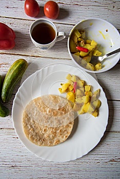 Popular breakfast food items paratha and cooked potatoes