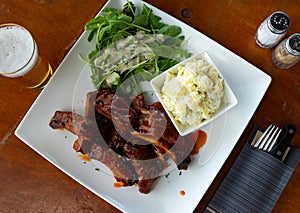 Popular dish of Belgian cuisine is marinated ribs with potatoes
