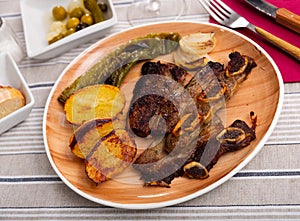 Popular dish of grilled beef Churrasco, potatoes and peppers