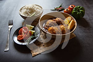 Popular Indian lunch ingredient egg curry in a bowl. Generally served with rice and salad condiments.